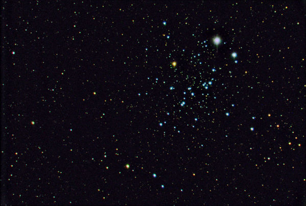 NGC 457 -- The Owl Cluster
NGC 457 -- The Owl Cluster, and open cluster in Cassiopeia.  Processed in February 2006 in Maxim DL and Photoshop.  Gradients were removed with Russ Croman's [url=http://www.rc-astro.com/resources/GradientXTerminator/index.html]Gradient Xterminator[/url].  I also applied Don Wade's [url=http://www.waid-observatory.com/article-star-color.html]star color enhancement techniques[/url].  The original exposures were too short, so the read noise was a factor in the final images.  It also appears that the color images are not perfectly aligned, or the red in the lower left of each star may be due to the extensive color enhancement.

