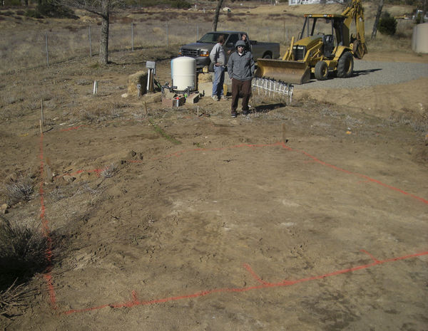 Graded and Marked
The site has been graded to its two levels and the lines for the footings are marked.
