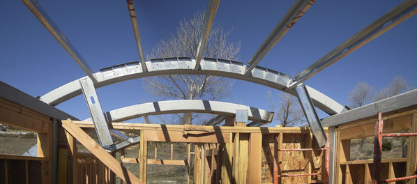 Roof Arch Detail
The detail of the two arched roof can be clearly seen in this shot that looks west from inside the observatory.  Wheels will be attached to the larger arched roof after framing is complete.  The wall in the foreground will be built up to be just under the arch of the roof.
